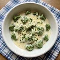Nhoque de Espinafre ao Creme de Queijo, Gnocchi della Fortuna