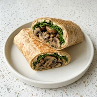 Wrap de Cogumelo com Rúcula, Raiz & Folha